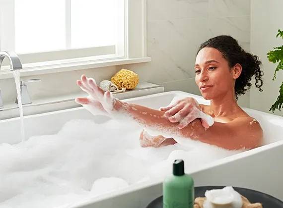 Woman enjoying a relaxing bath with soft water