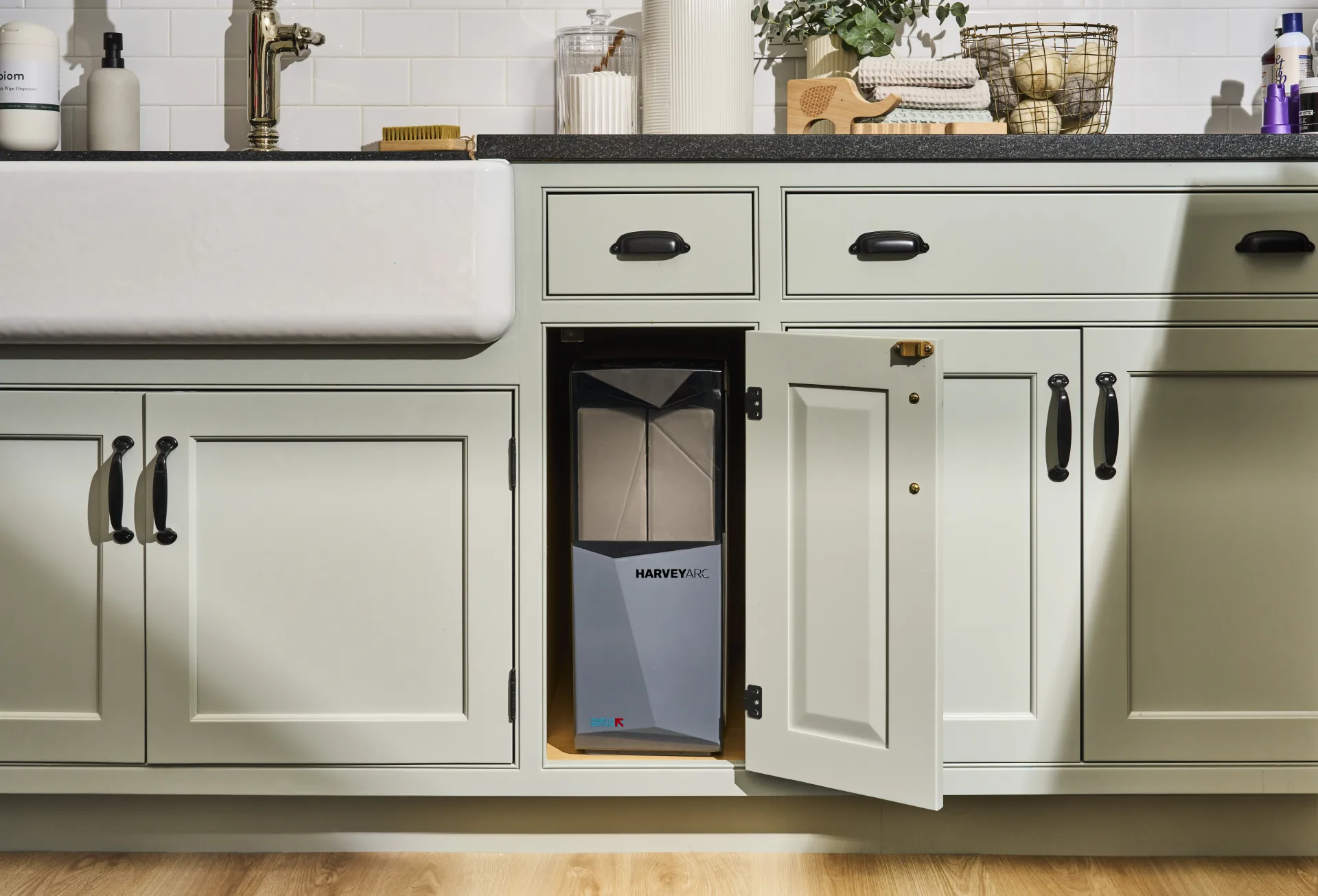 Modern kitchen with water softener system installed under sink